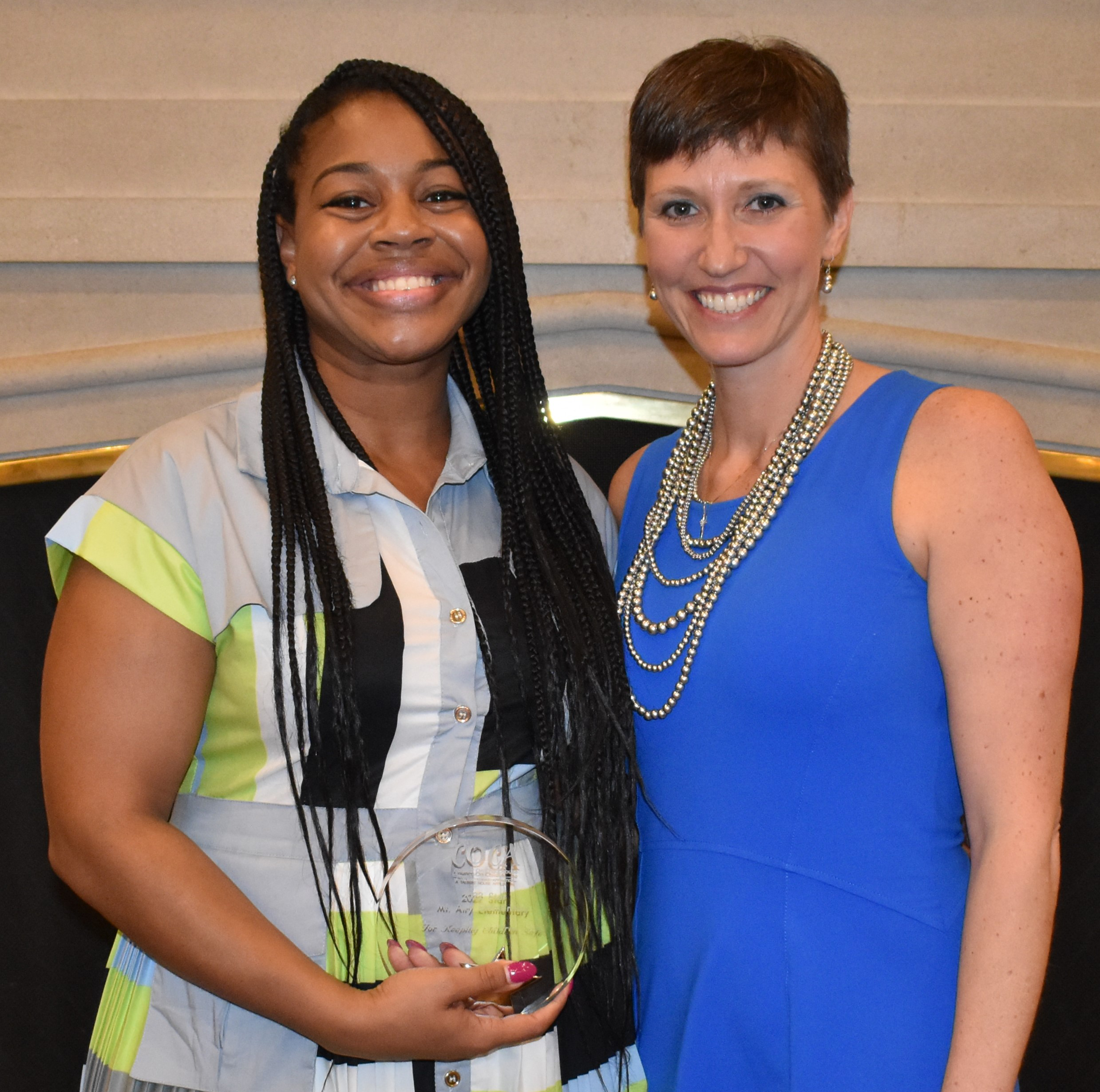 Lindsay Whittle of Mt. Airy Elementary and Julie Johnson COCA Board President with award